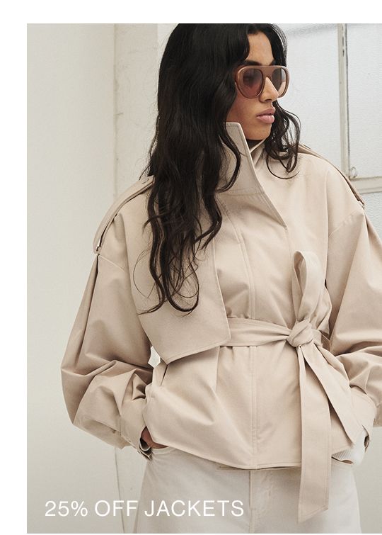 Model posing in a cropped trench with text overlay: "25% OFF JACKETS"